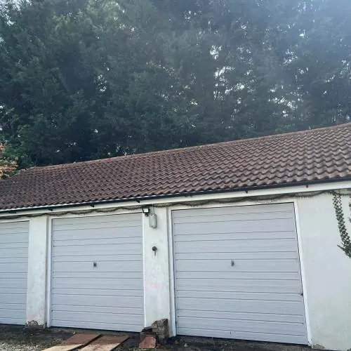 Garage with a clay tile roof before roof repairs